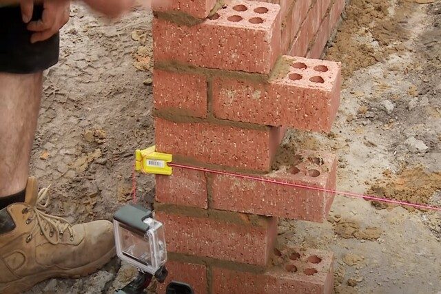 Brick laying by a worker